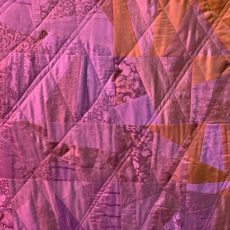 Detail shot of white quilted altar cloth