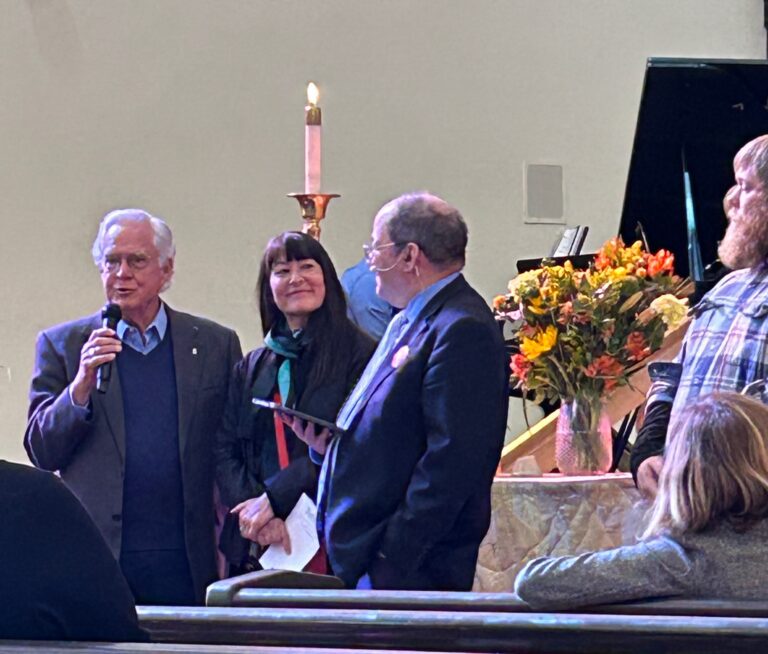 Jon and Pastor Mike welcoming Michelle and Travis as new members