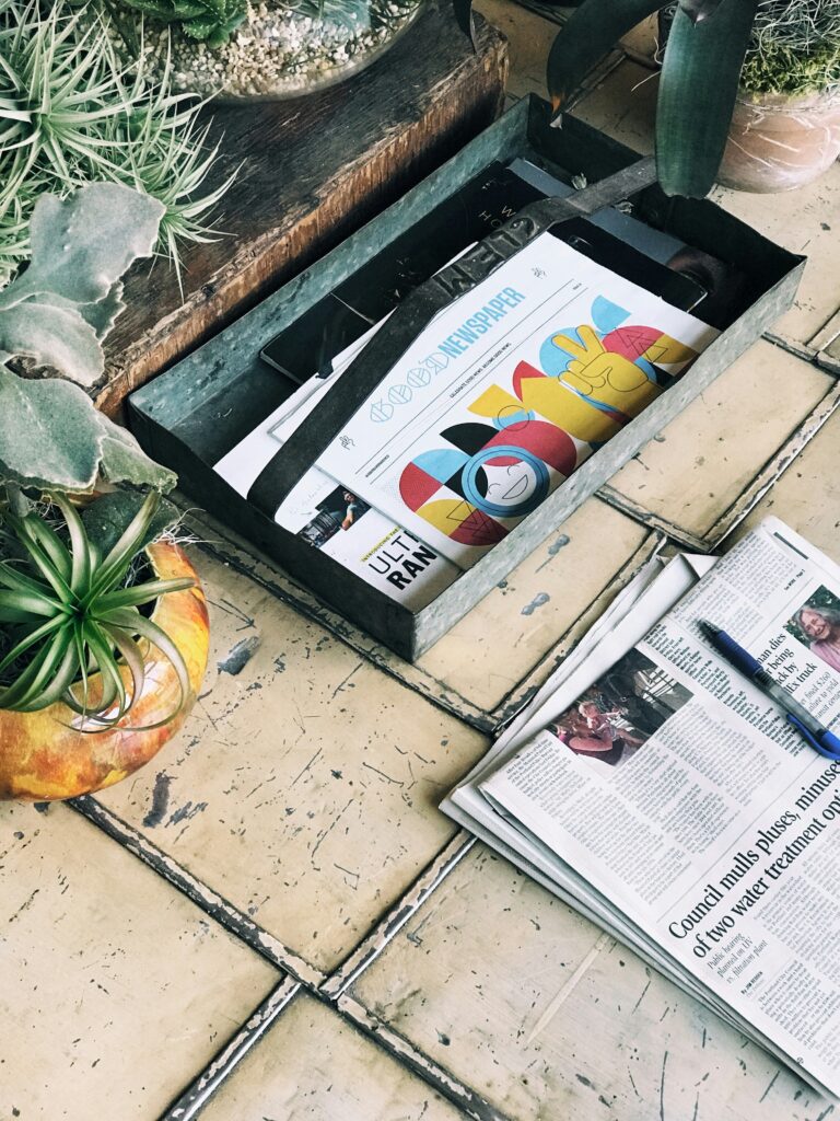 Paper entitled "Good Newspaper" on a front stoop