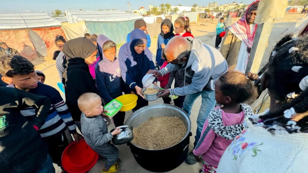 A photo of people being fed in Gaza