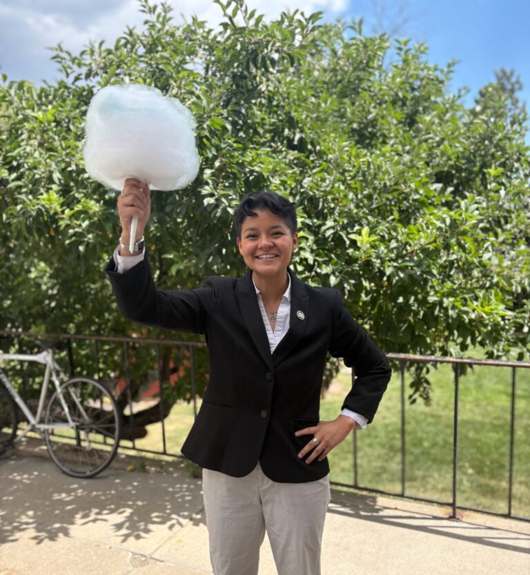 Jalen holding cotton candy on the patio