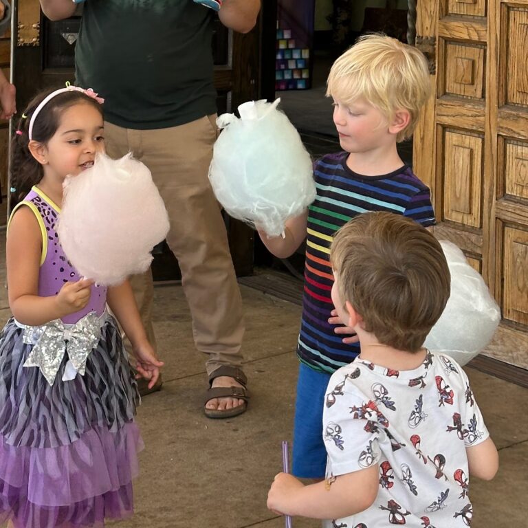 Children eating cotton candy on the patio at First Church