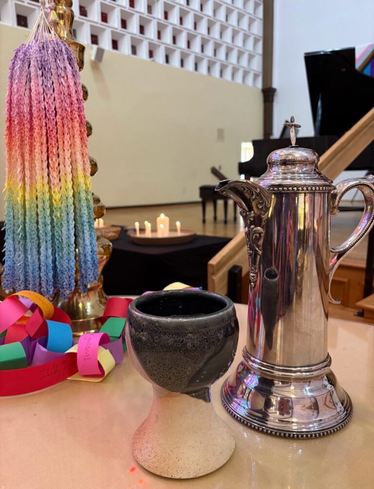 Image of pitcher and chalice on First Church's altar