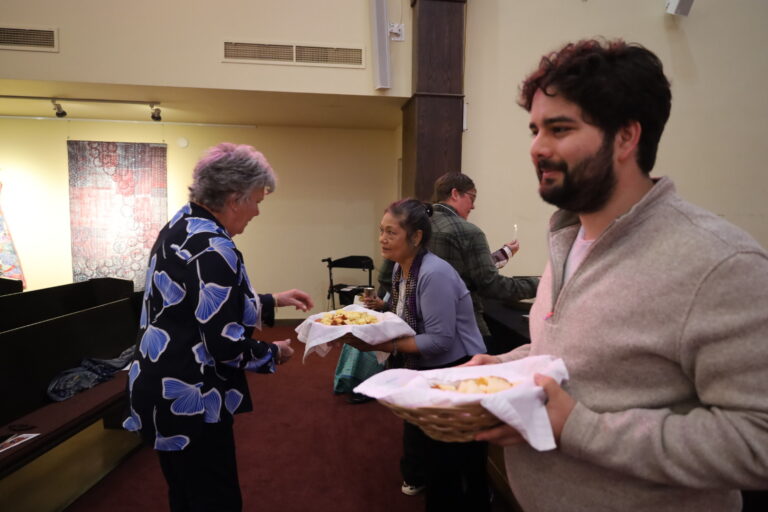 First Church members serving and receiving communion