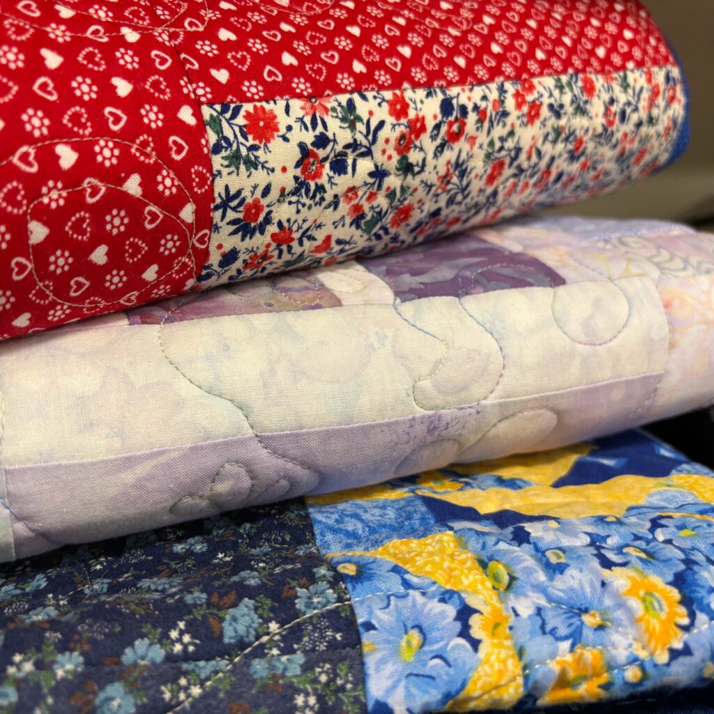 Image of 3 stacked and folded quilts