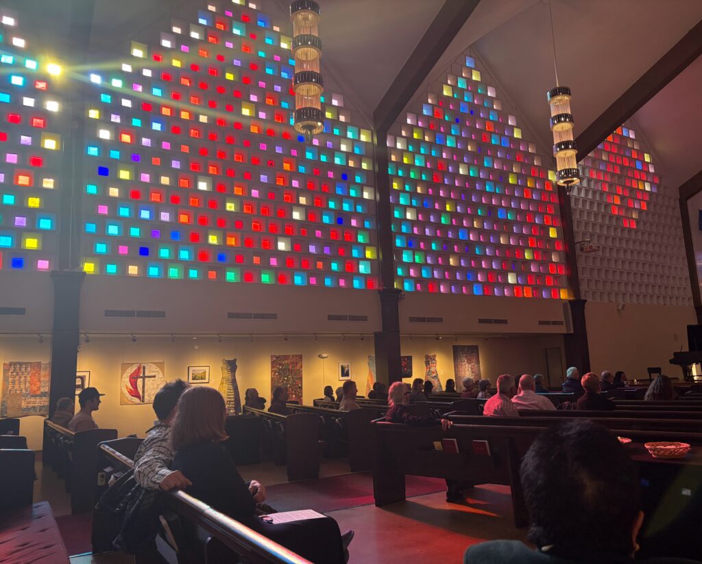 Sunlight coming in through sanctuary windows during service