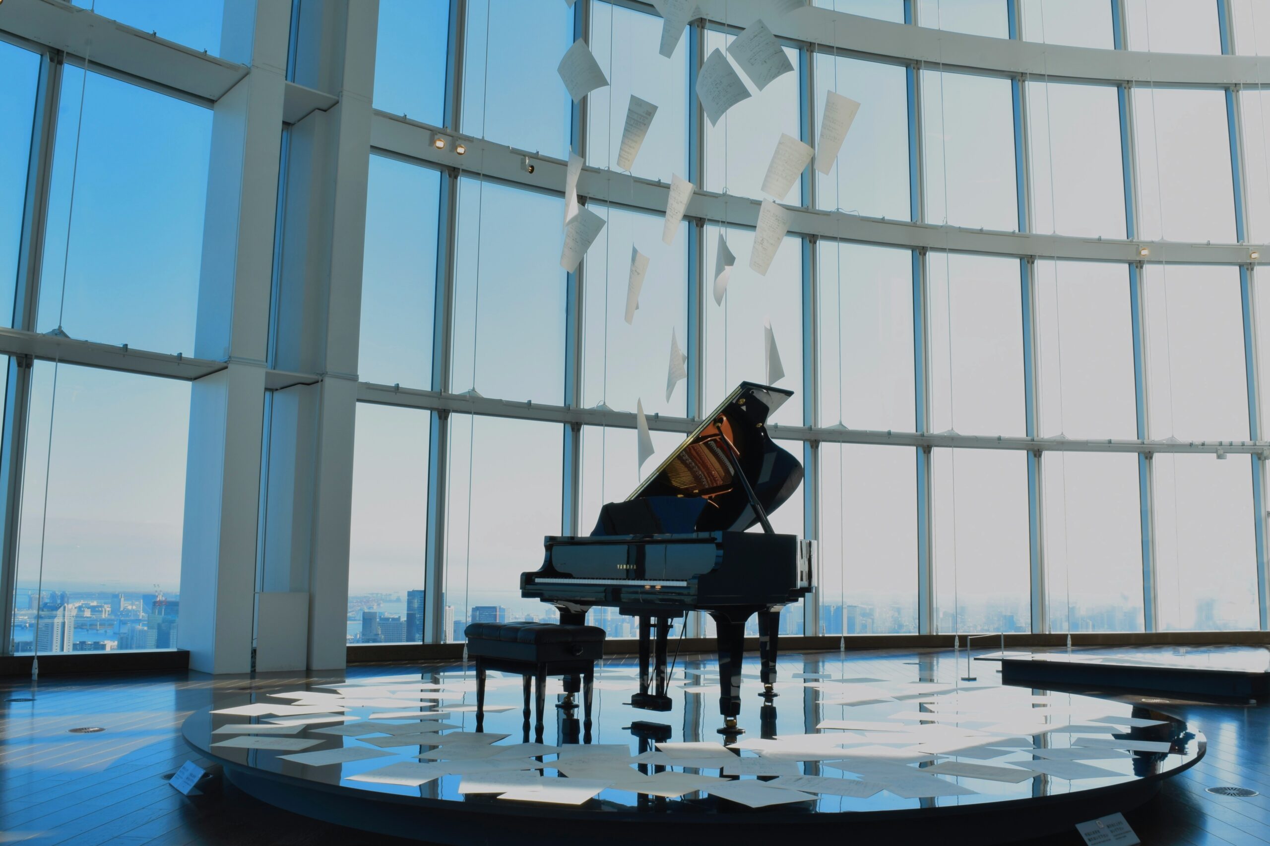 Piano in front of windows